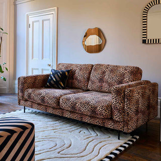 A beautiful leopard print sofa in a living room