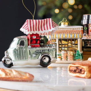 Foodie christmas tree decoration display featuring a barista truck, sausage roll decoration and baguette decoration.