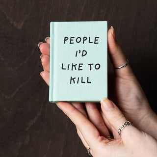 Image of Rockett St George Fuck Off Black Satin Feel Sleep Mask on a white surface.