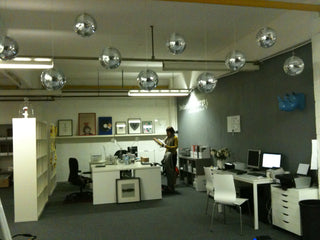 The first Rockett St George office with disco balls.