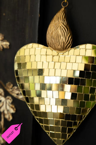The Disco Ball Flaming Heart Decoration styled on a black unit