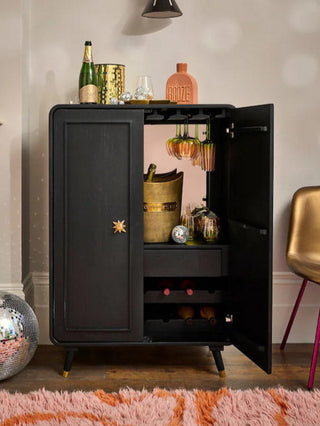 Lifestyle image of the Black & Gold Ringo Drinks Cabinet