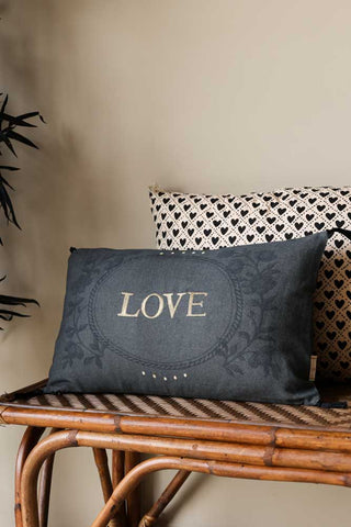 Lifestyle image of the Embroidered Love Cotton Cushion