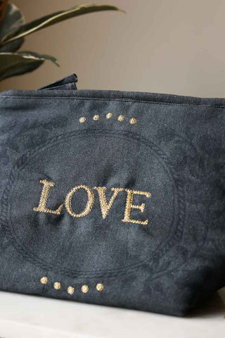 Close-up image of the Embroidered Love Cotton Pouch