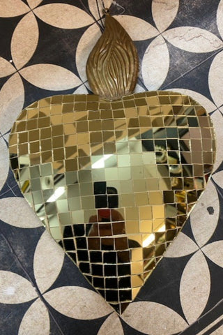 The The Disco Ball Flaming Heart Decoration against a monochrome background.