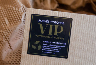 Image showing a cardboard box with a Rockett St George 'Very Important Package' label applied.