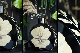 three images of the black floral vase