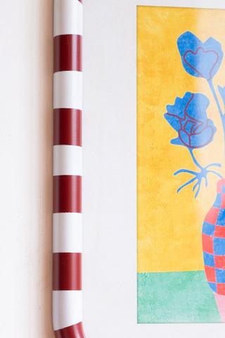 Close-up of the frame of the Set of 2 Red & White Striped Frames with Colourful Flower Prints.