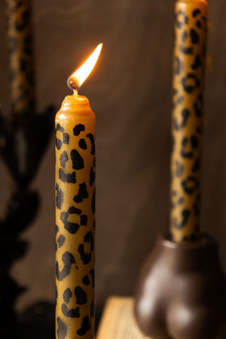 Close-up image of the Set Of 4 Leopard Print Dinner Candles