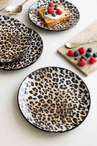 The Set of 4 Natural Leopard Love Side Plates styled with a serving board, cutlery, toast and some berries.