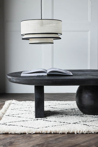 Image of the Abstract Black Mango Wood Coffee Table in a living room setting