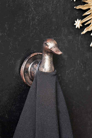 Lifestyle image of the Antique Copper Duck Head Wall Hook