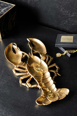 Lifestyle image of the Antique Gold Lobster Trinket Tray