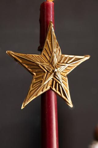 Close-up image of the Antique Gold Star Candle Pin