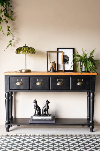 A styled image of the Apothecary Console Table against a white wall.