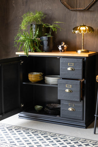 A styled image of the Small Apothecary Sideboard with its cupboard open and bowls and plates in it.