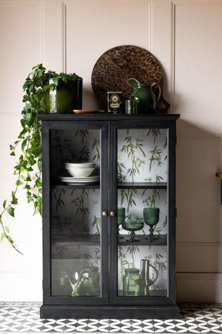 Lifestyle image of the Black Display Cabinet with Bamboo Print Lining