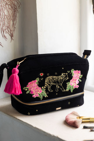 Lifestyle image of the Black Embroidered Tiger Velvet Wash Bag