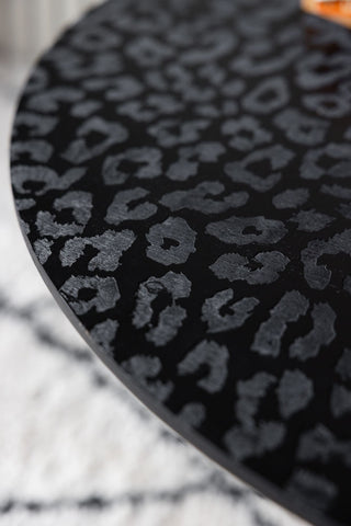 Close up image of the black leopard love coffee table. 