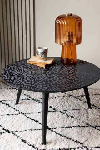 Lifestyle image of the black leopard love coffee table. 