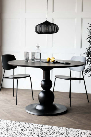 Lifestyle image of the Black Mango Wood Round Dining Table