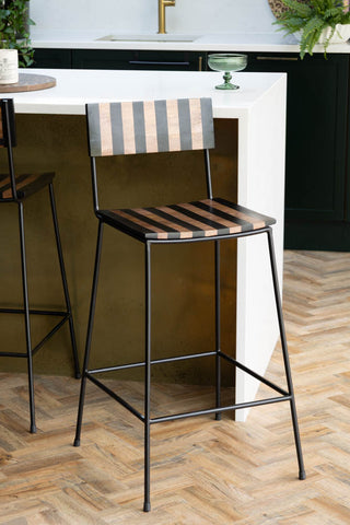 Black Stripe Wooden Bar Stool against kitchen island