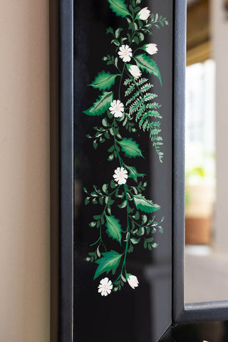Close-up image of the Black & Floral Wooden Framed Mirror