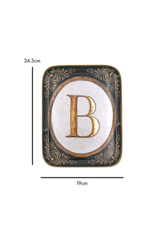 Cutout image of a black and gold letter B tray on a white background with dimensions. 