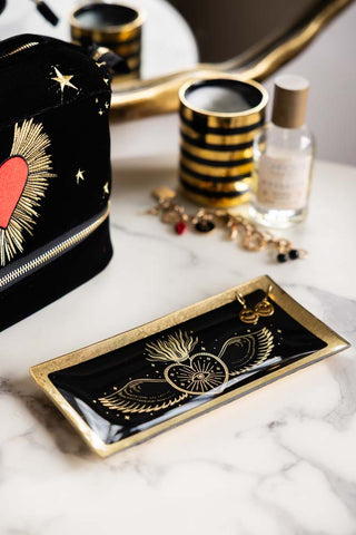 Lifestyle image of the Black & Gold Milagro Heart Trinket Tray
