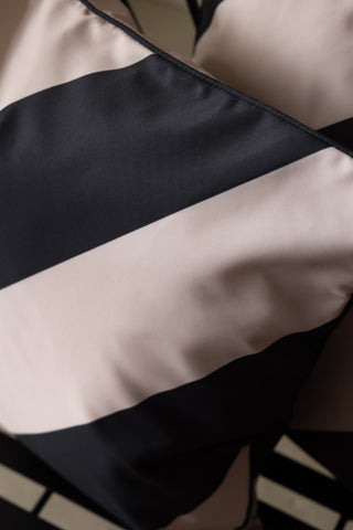 Close-up image of the Black & Natural Stripe Outdoor Cushion