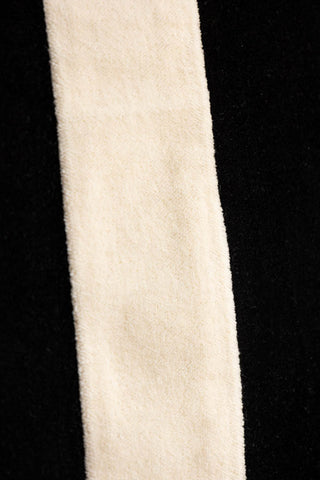 Close-up image of the Black & Off-White Stripe Velvet Cushion.