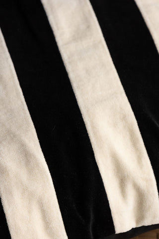 Close-up image of the Black & Off-White Stripe Velvet Cushion. 