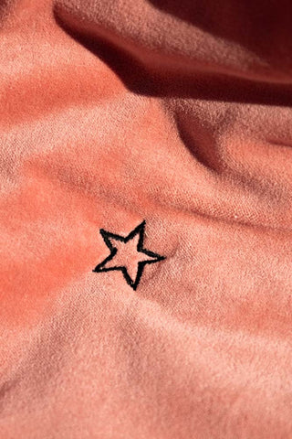 Detail shot of the star design on the Black & Pink Velvet Tiger Reversible Quilt.