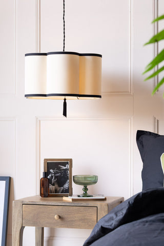 Lifestyle image of the Black & Cream Lantern Curved Ceiling Light Shade styled in blush pink bedroom.