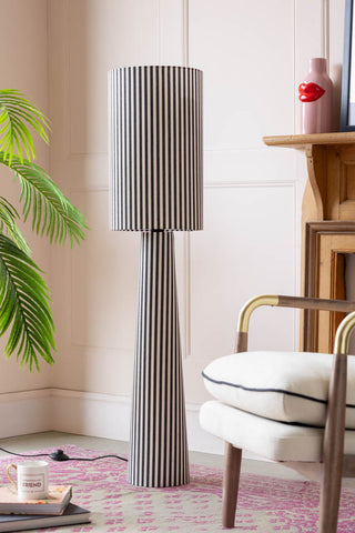 Lifestyle image of the Black & White Stripe Floor Lamp in pink living room