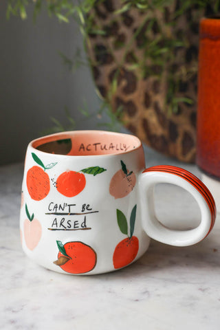Lifestyle image of the Can't Be Arsed Mug