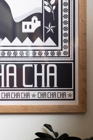 Styled detail image of the Cha Cha A2 Art Print in Black in a natural frame