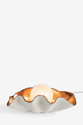 Cutout image of the Clam Table Lamp on a white background.