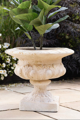 The Classical Stone-Effect Planter outside.