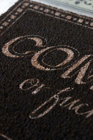 Close-up of the Come In or Fuck Off Doormat.