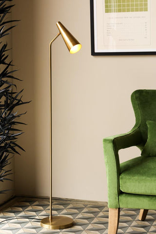 Image of the Contemporary Brass Floor Lamp next to a armchair