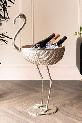 Image of the Enamel Metallic & Pale Pink Flamingo Wine Cooler shown with three wine bottles inside.
