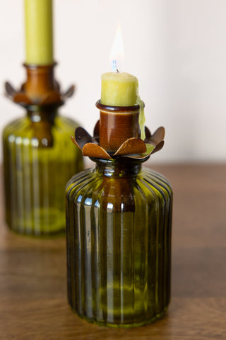 beautiful flower candlestick holder for bottles. The bronze candlestick holder for bottles is styled in a green ribbed bottle.