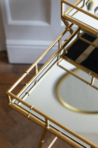 Image of the mirror on the Gold Bamboo Design Nest Of Tables