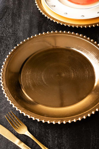 Lifestyle image of the Gold Beaded Charger Plate