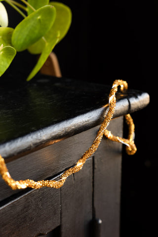 Lifestyle image of the Gold Beaded Garland with Fairy Lights