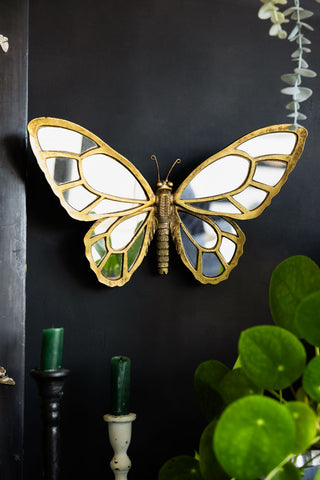 Lifestyle image of the Gold Butterfly Decorative Wall Mirror