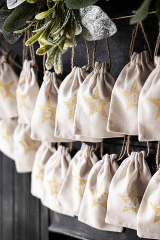 Lifestyle image of Gold Christmas Advent Calendar Pouches.