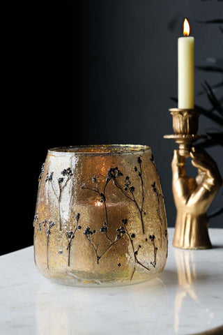 Lifestyle image of the Gold Dried Flowers Glass Candle Holder