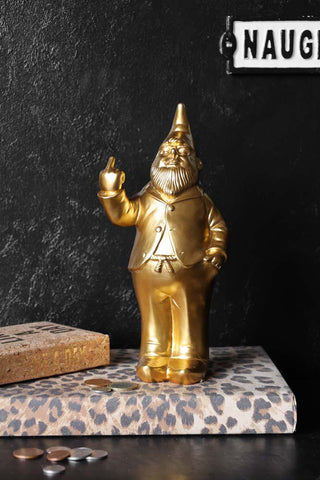 Lifestyle image of the Gold Naughty Gnome Money Box
